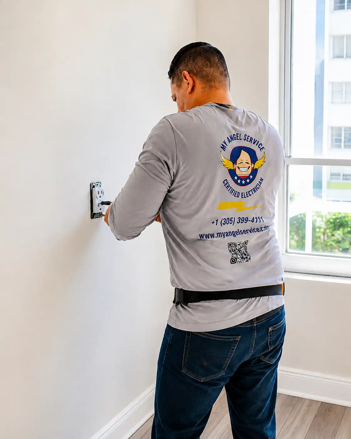 My angel Service certified electrician performing a GFCI electric service in Miami residence