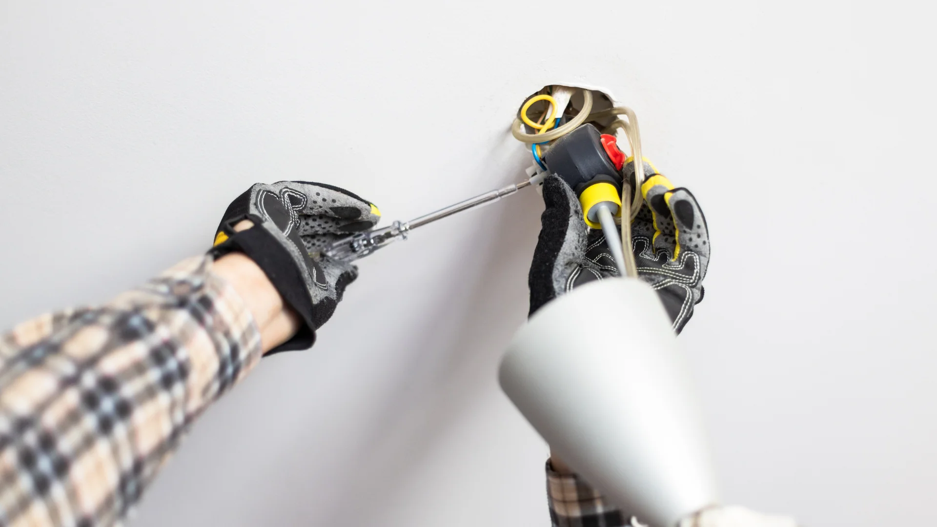 lightning repairing electrician repairing a ceiling light