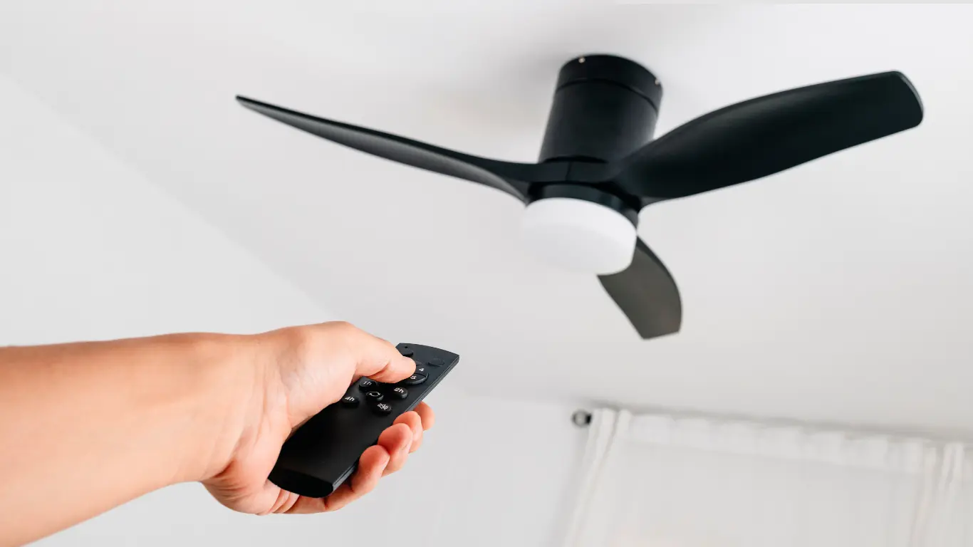ceiling fan with remote control Ceiling fan with remote control installed in a modern indoor space.