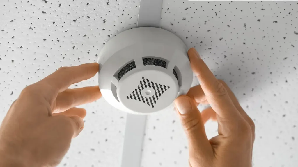 smoke detector installation electrician installing a smoke detector